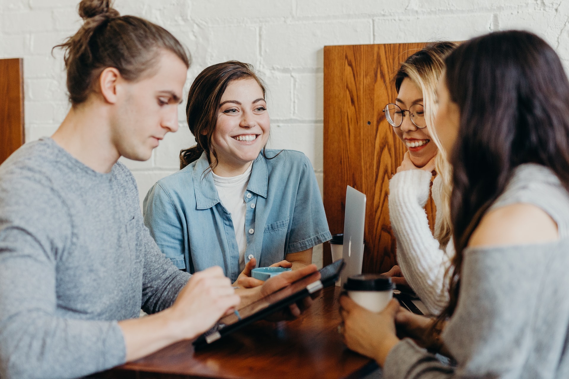 people are communicating at the table
