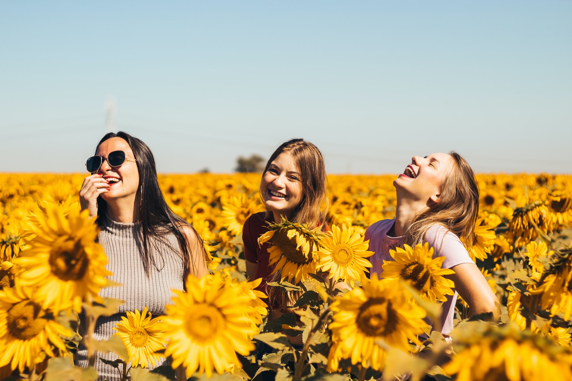 three women are smiling